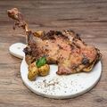 Roasted and cooked duck-style shoulder of lamb